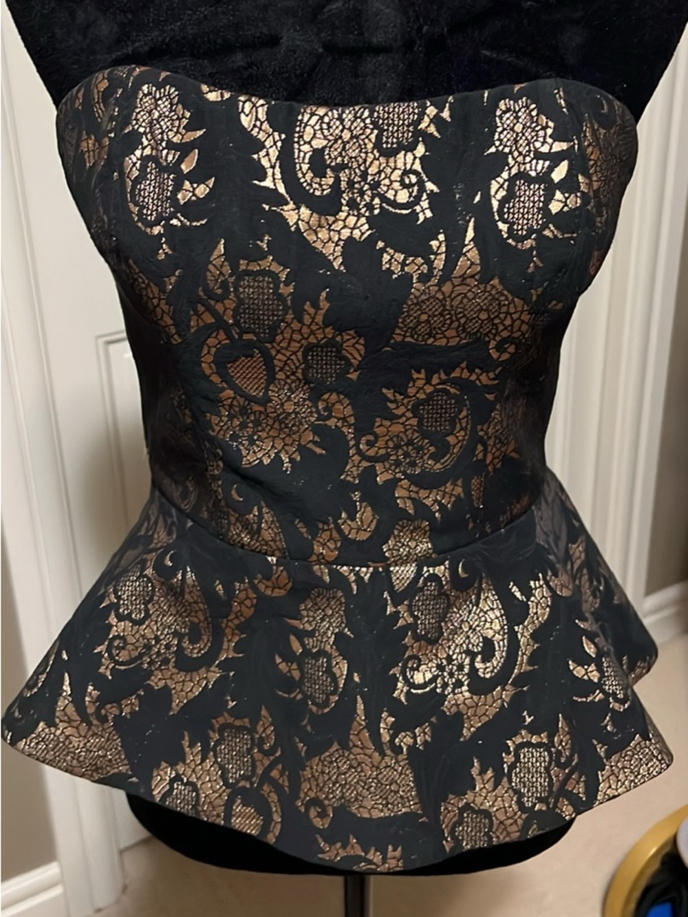 bebe Black and Gold Lace Strapless Peplum Top